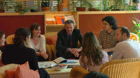 People discussing round a table